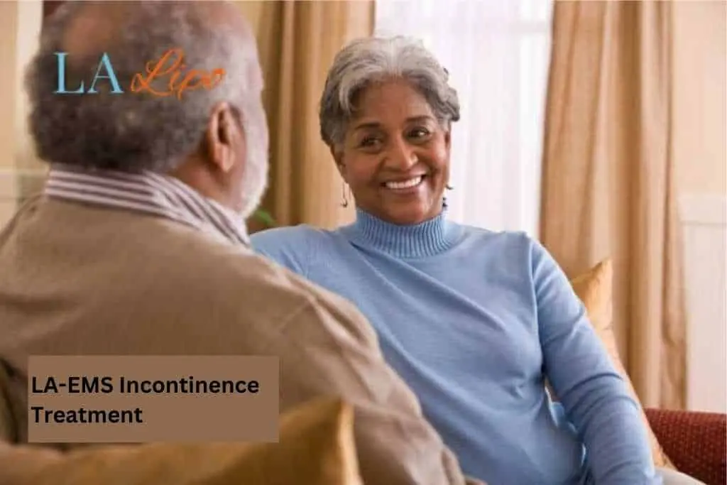 Couple sat smiling at each other - LA-EMS treatment Mitcham